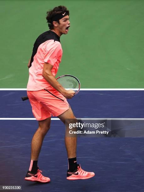 Taylor Fritz of the USA celebrates victory after his match against Andrey Rublev of Russia during the BNP Paribas Open at the Indian Wells Tennis...