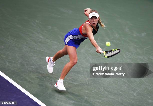 Caroline Wozniaki of Denmark hits a backhand during her match against Lara Arrubarrena during the BNP Paribas Open at the Indian Wells Tennis Garden...