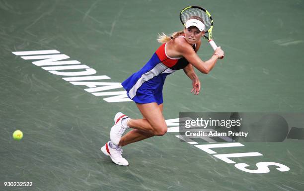 Caroline Wozniaki of Denmark hits a backhand during her match against Lara Arrubarrena during the BNP Paribas Open at the Indian Wells Tennis Garden...