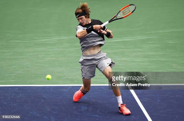 Andrey Rublev of Russia hits a forehand during his match against Taylor Fritz of the USA during the BNP Paribas Open at the Indian Wells Tennis...