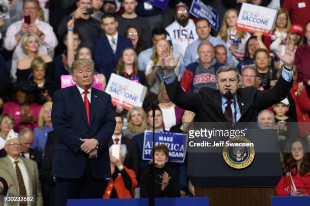 President Donald J. Trump with Rick Saccone speaks to supporters at the Atlantic Aviation Hanger on March 10, 2018 in Moon Township, Pennsylvania....