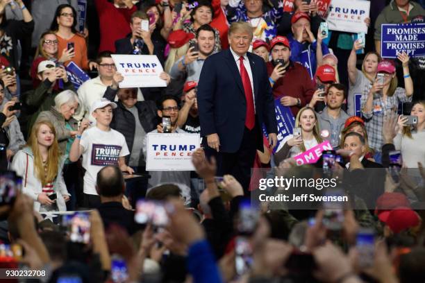 President Donald J. Trump walks out to speak to supporters at the Atlantic Aviation Hanger on March 10, 2018 in Moon Township, Pennsylvania. The...