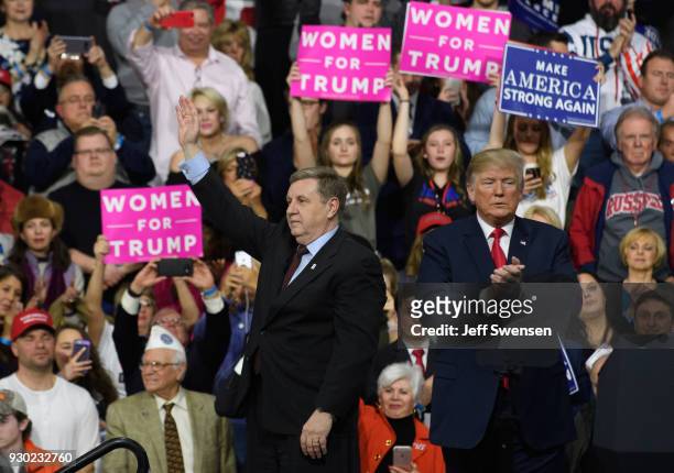 President Donald J. Trump with Rick Saccone speaks to supporters at the Atlantic Aviation Hanger on March 10, 2018 in Moon Township, Pennsylvania....
