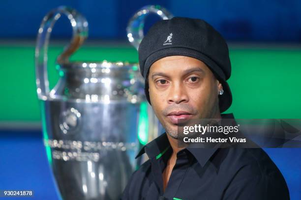 Former Brazilian soccer player Ronaldinho poses during the UEFA Champions League Trophy Tour presented by Heineken on March 09, 2018 in Mexico City,...