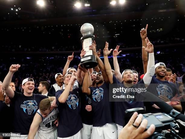 The Villanova Wildcats celebrate with the championship trophy after their overtime win over the Providence Friars during the championship game of the...