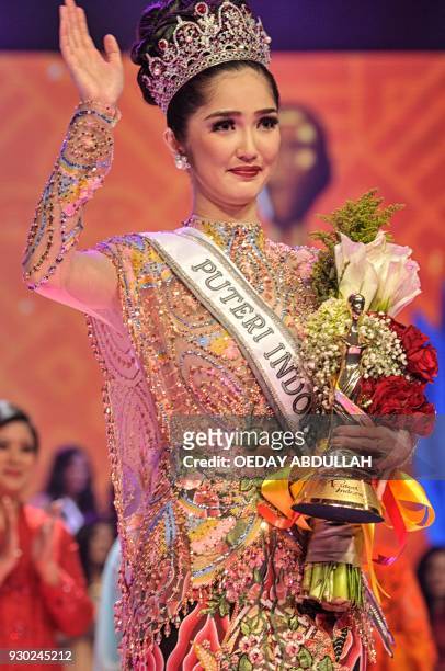 This picture taken on March 9, 2018 shows the newly crowned Miss Indonesia 2018 Sonia Fergina during the finals of the 2018 Miss Indonesia beauty...