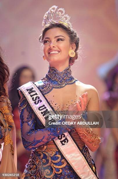 This picture taken on March 9, 2018 shows South Africa's Miss Universe Demi-Leigh Nel-Peters during the finals of the 2018 Miss Indonesia beauty...