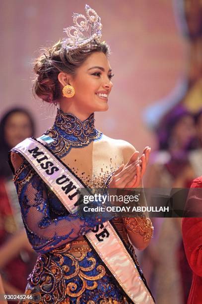 This picture taken on March 9, 2018 shows South Africa's Miss Universe Demi-Leigh Nel-Peters during the finals of the 2018 Miss Indonesia beauty...