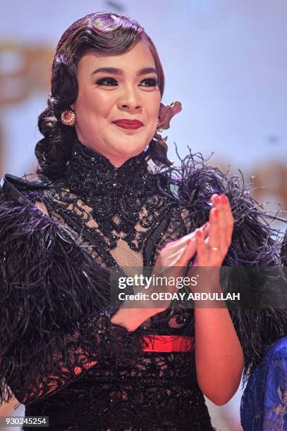 This picture taken on March 9, 2018 shows model and Miss Universe Indonesia 2016, Kezia Warouw during the finals of the 2018 Miss Indonesia beauty...