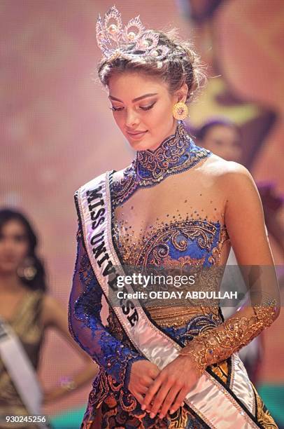 This picture taken on March 9, 2018 shows South Africa's Miss Universe Demi-Leigh Nel-Peters during the finals of the 2018 Miss Indonesia beauty...