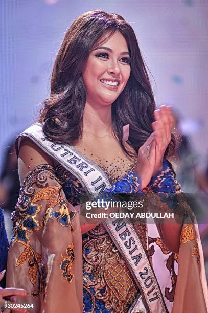 This picture taken on March 9, 2018 shows actress and Miss Indonesia 2017 Bunga Jelitha during the finals of the 2018 Miss Indonesia beauty pageant...