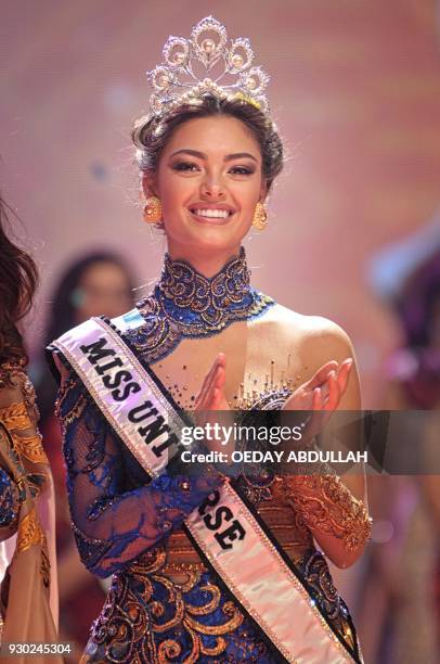 This picture taken on March 9, 2018 shows South Africa's Miss Universe Demi-Leigh Nel-Peters during the finals of the 2018 Miss Indonesia beauty...