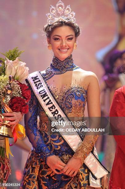 This picture taken on March 9, 2018 shows South Africa's Miss Universe Demi-Leigh Nel-Peters during the finals of the 2018 Miss Indonesia beauty...