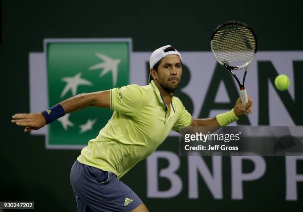 Fernando Verdasco of Spain lunges to return a forehand to Grigor Dimitrov of Russia during the BNP Paribas Open on March 10, 2018 at the Indian Wells...