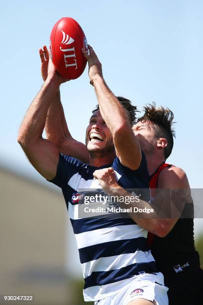 Tom Hawkins of the Cats kicks the ball for a goal competes for the ball during the JLT Community Series AFL match between the Geelong Cats and the...