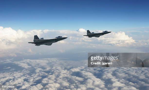 two military jets above the clouds - us air force stock pictures, royalty-free photos & images