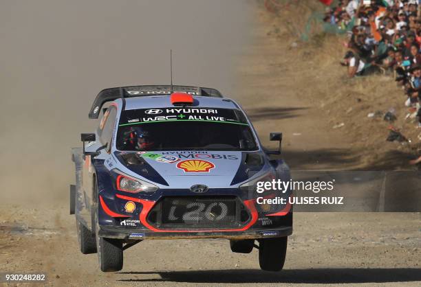 Spanish driver Dani Sordo and co-driver Carlos Del Barrio steer their Hyundai i20 Coupe WRC during the second day of the 2018 FIA World Rally...