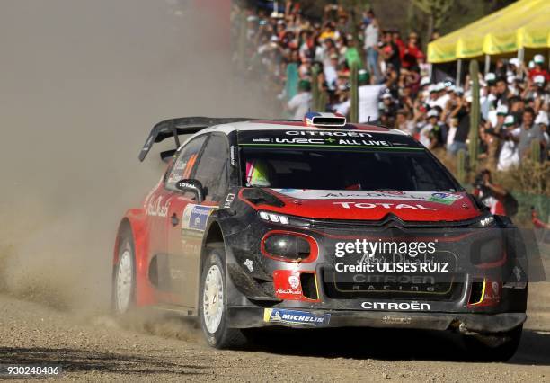 French driver Sebastien Loeb and co-driver Monegasque Daniel Elena steer their Citroen C3 during the second day of the 2018 FIA World Rally...