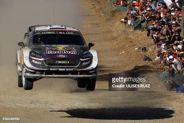 French driver Sebastian Ogier and co-driver Julien Ingrassia steers his Ford Fiesta WRC during the second day of the 2018 FIA World Rally...