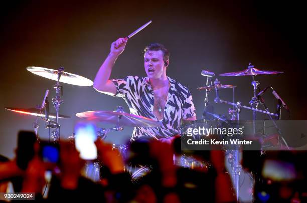Ashton Irwin of 5 Seconds of Summer performs during the iHeartRadio Music Awards Fan Army celebration presented by Taco Bell with 5 Seconds Of Summer...