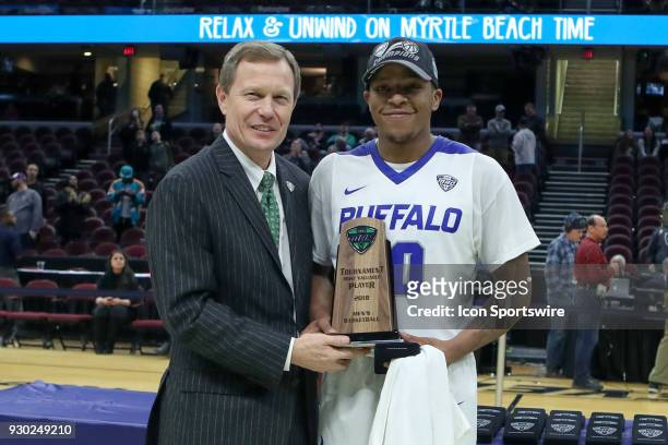 Mid-American Conference Commissioner Dr. Jon A. Steinbrecher presents the tournament MVP award to Buffalo Bulls guard Wes Clark following the MAC...
