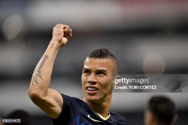 America's Mateus Uribe celebrates after scoring a goal against Leon during their Mexican Clausura 2018 tournament football match at the Azteca...