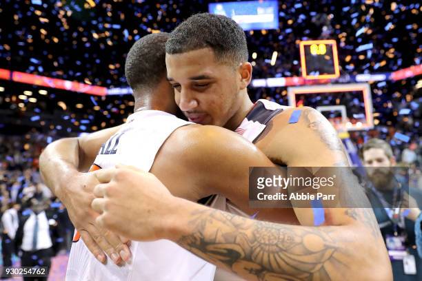 Devon Hall and Isaiah Wilkins of the Virginia Cavaliers celebrate after defeating the North Carolina Tar Heels 71-63 during the championship game of...