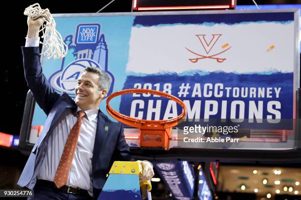 Head coach Tony Bennett of the Virginia Cavaliers cuts down the net after defeating the North Carolina Tar Heels 71-63 during the championship game...