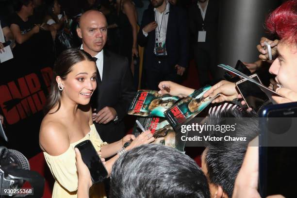 Actress Alicia Vikander signs autographs and takes selfies with fans during the "Tomb Raider" Mexico City premiere at Oasis Coyoacan on March 10,...