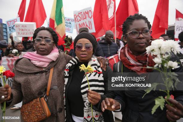 Some women with flowers during the demonstration that took place in Naples against racism and for Idy Diene, a Senegalese street vendor killed in...