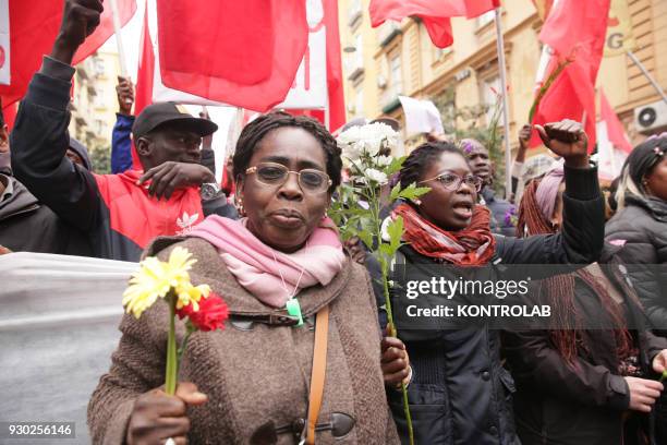 Some people with flowers during the demonstration that took place in Naples against racism and for Idy Diene, a Senegalese street vendor killed in...