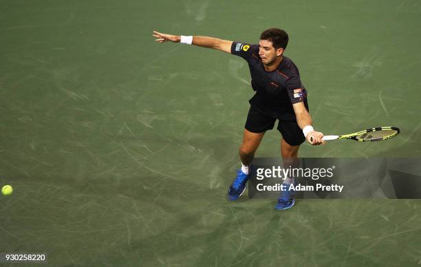 Federico Delbonis of Argentina hits a forehand during his match against Roger Federer of Switzerland during the BNP Paribas Open at the Indian Wells...