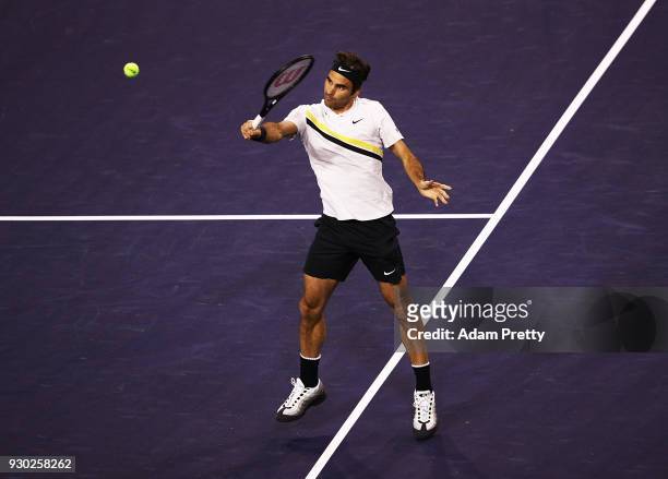 Roger Federer of Switzerland hits a backhand during his match against Federico Delbonis of Argentina during the BNP Paribas Open at the Indian Wells...
