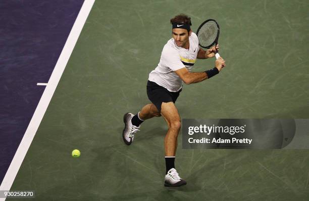 Roger Federer of Switzerland hits a backhand during his match against Federico Delbonis of Argentina during the BNP Paribas Open at the Indian Wells...