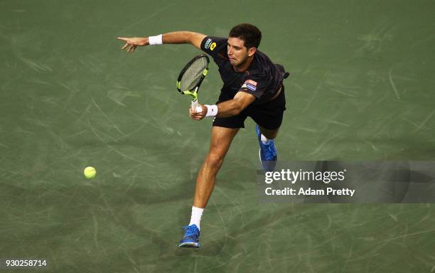 Federico Delbonis of Argentina hits a forehand during his match against Roger Federer of Switzerland during the BNP Paribas Open at the Indian Wells...