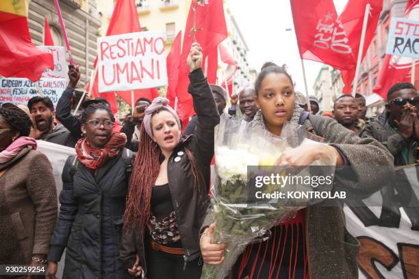 Some people with poster during the demonstration that took place in Naples against racism and for Idy Diene, a Senegalese street vendor killed in...