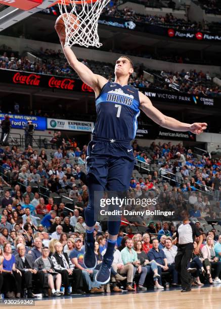 Dwight Powell of the Dallas Mavericks drives to the basket against the Memphis Grizzlies on March 10, 2018 at the American Airlines Center in Dallas,...