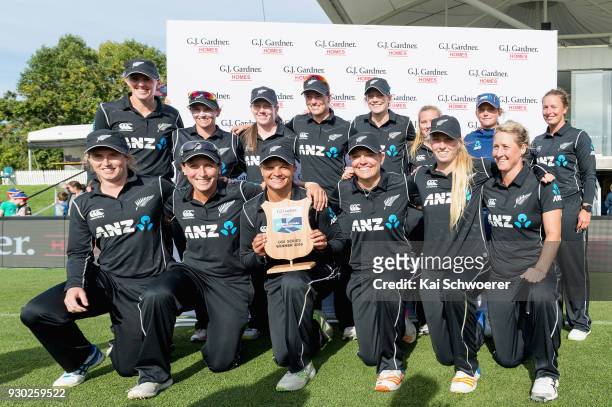 Captain Suzie Bates of New Zealand and her team mates pose with the ODI Series winner plate after their win in the Women's One Day International...