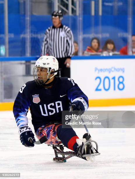 Rico Roman of United States in action against Japan in the Ice Hockey Preliminary Round - Group B game between United States and Japan during day two...