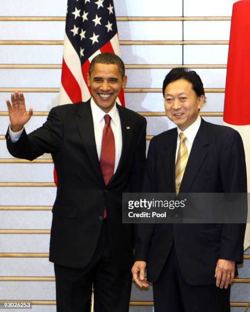 President Barack Obama greets the media with Japanese Prime Minister Yukio Hatoyama at the Prime Minister's official residence on November 13, 2009...
