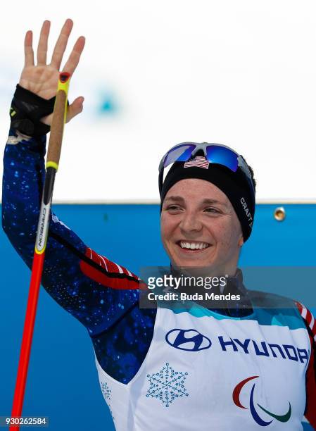 Kendall Gretsch of the United States celebrate after crossing the finish line in first place in the Women's Cross Country 12km - Sitting event at...