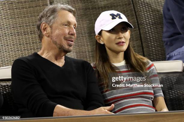 Oracle Co-founder Larry Ellison watch Roger Federer of Switzerland play Federico Delbonis of Argentina during the BNP Paribas Open at the Indian...