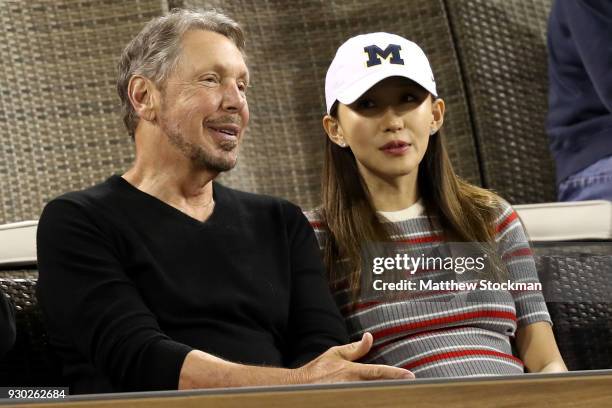 Oracle Co-founder Larry Ellison watch Roger Federer of Switzerland play Federico Delbonis of Argentina during the BNP Paribas Open at the Indian...