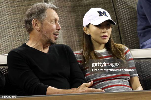 Oracle Co-founder Larry Ellison watch Roger Federer of Switzerland play Federico Delbonis of Argentina during the BNP Paribas Open at the Indian...