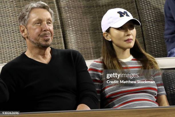 Oracle Co-founder Larry Ellison watch Roger Federer of Switzerland play Federico Delbonis of Argentina during the BNP Paribas Open at the Indian...