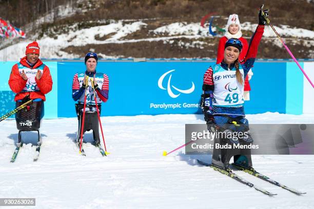 Oksana Masters of the United States celebrates after crossing the finish line in first place in the Women's Cross Country 12km - Sitting event at...