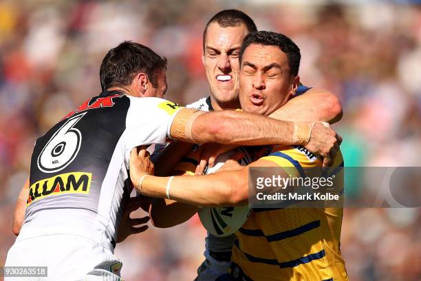 Brad Takairangi of the Eels is tackled during the round one NRL match between the Penrith Panthers and the Parramatta Eels at Panthers Stadium on...
