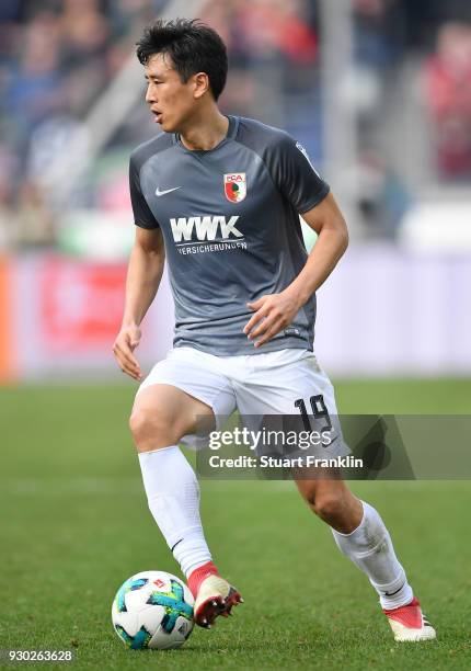 Ja-Cheol Koo of Augsburg in acion during the Bundesliga match between Hannover 96 and FC Augsburg at HDI-Arena on March 10, 2018 in Hanover, Germany.