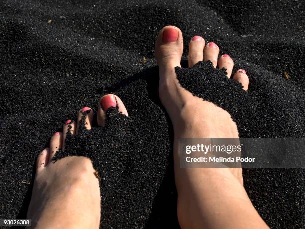 feet on a black sand beach - black sand stock pictures, royalty-free photos & images