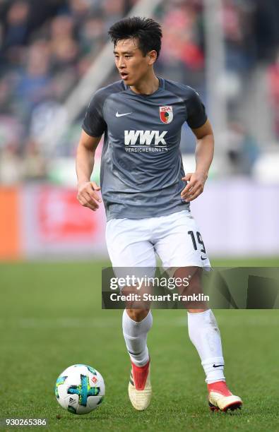 Ja-Cheol Koo of Augsburg in acion during the Bundesliga match between Hannover 96 and FC Augsburg at HDI-Arena on March 10, 2018 in Hanover, Germany.